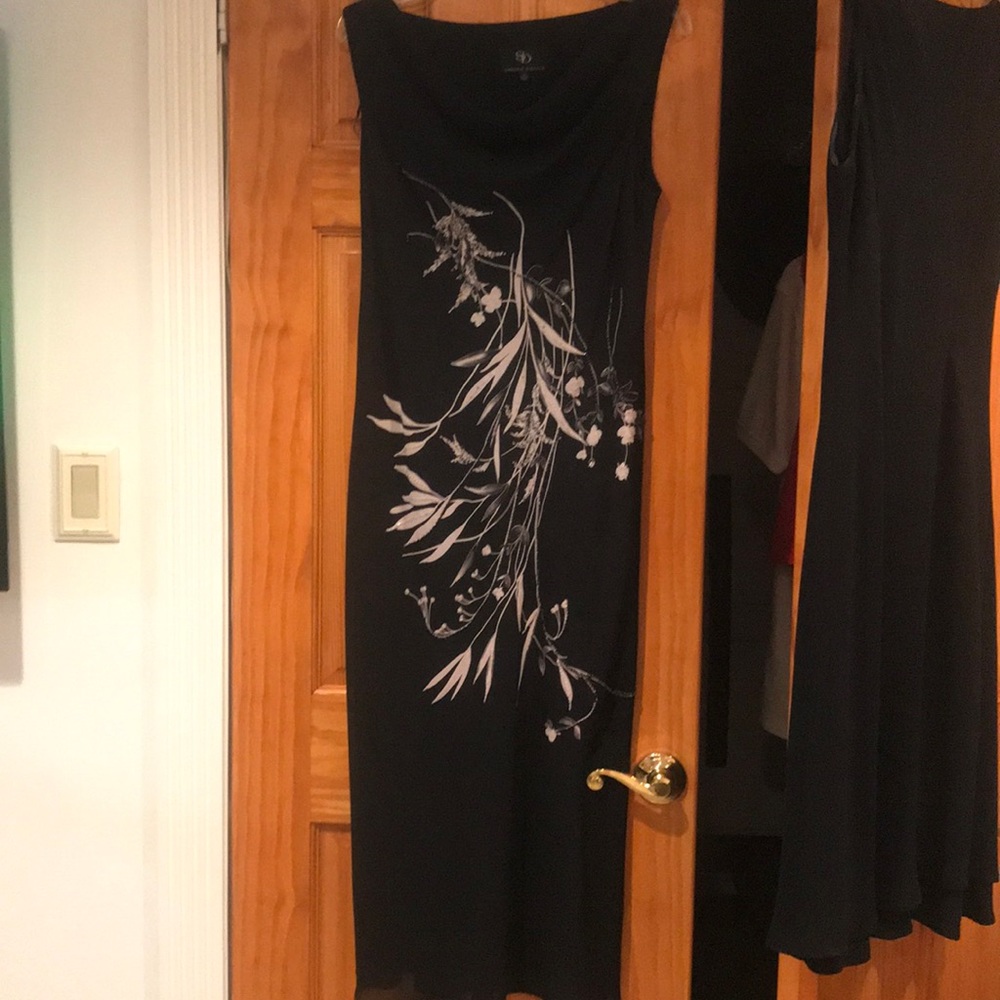 Sleeveless black dress with grey floral design